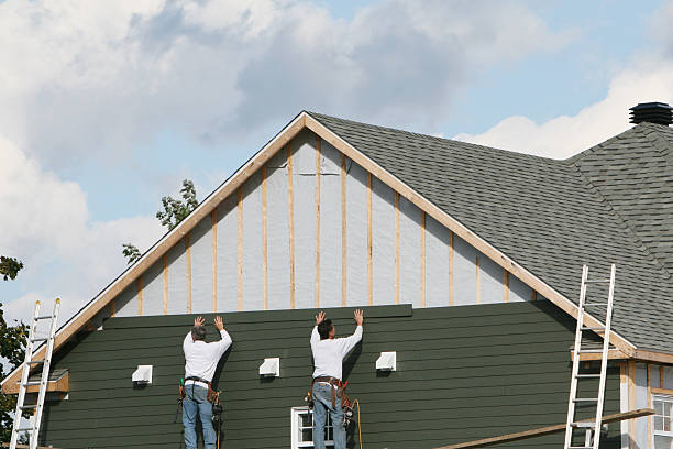 Professional Storm Damage Siding Repair technician working in Woburn, MA
